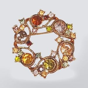 Lovely vintage‎ Monet gold tone multi colored rhinestone circle brooch
